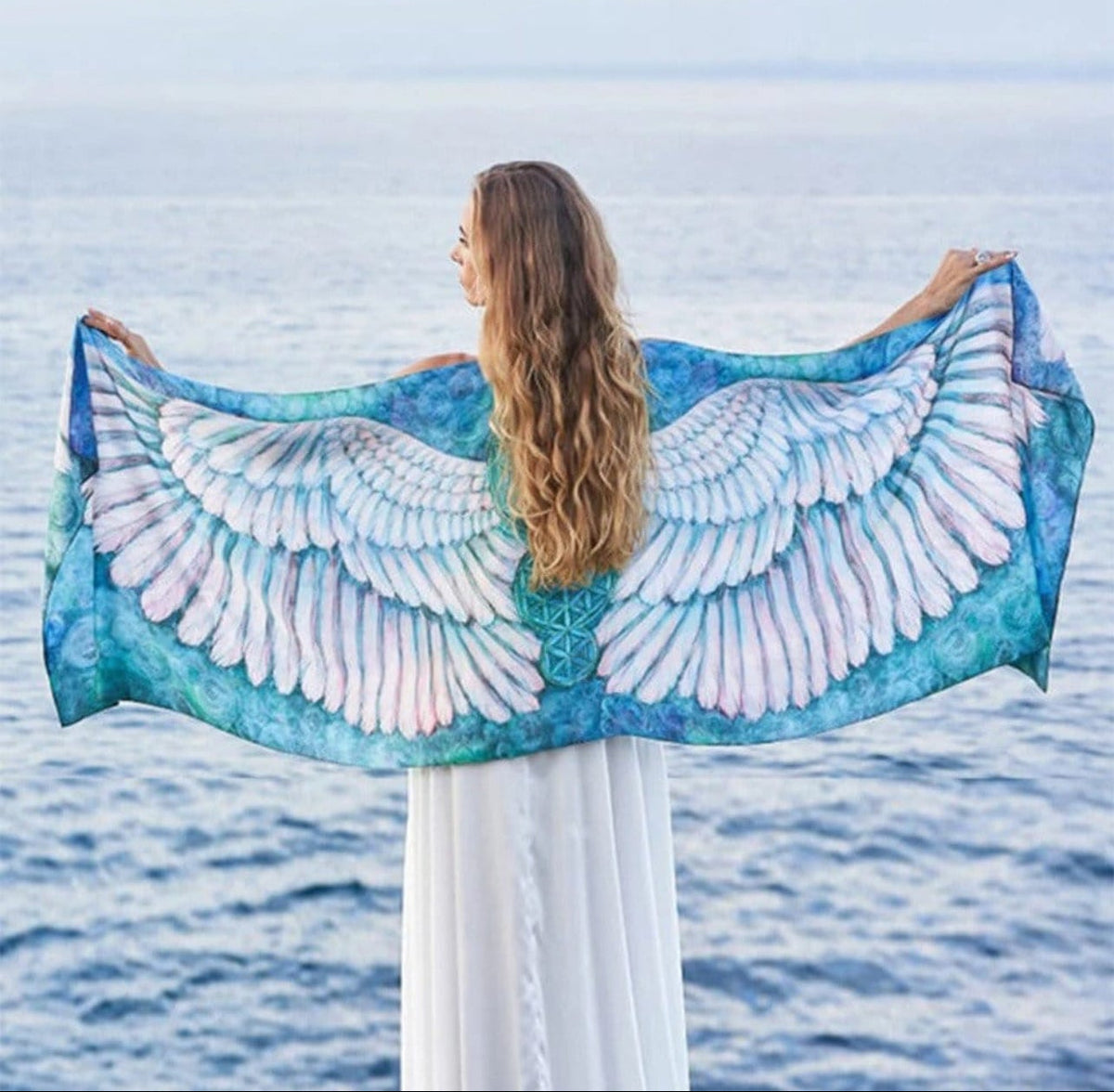 turquoise and pink ombre scarf with angel wings pattern.