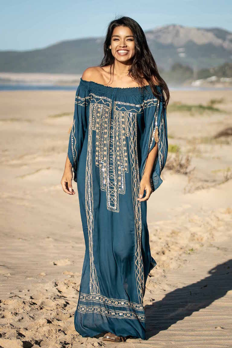 spanish beach dresses Young Woman Wearing A Beautiful White Dress In Spanish Fashion On A Boardwalk On The Beach Photo (222427)